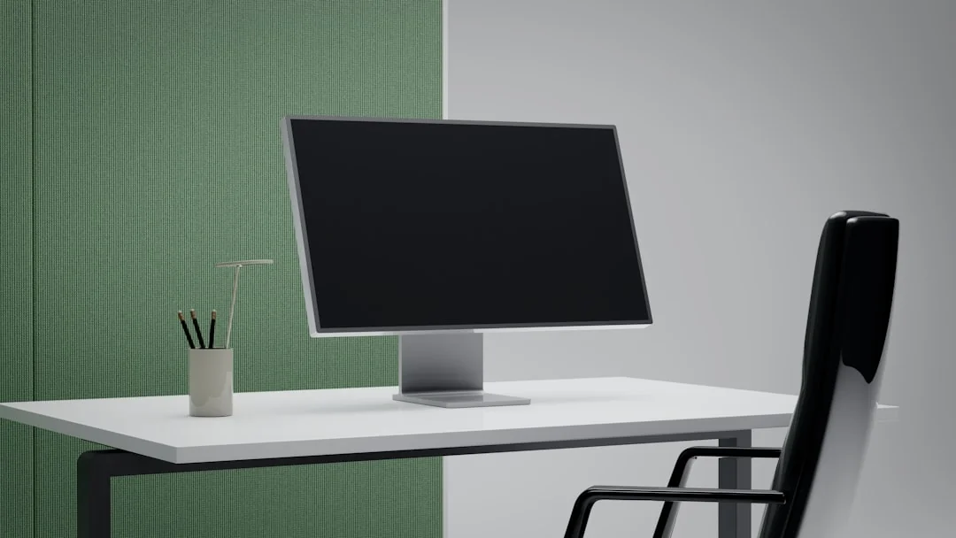 Spacious and contemporary office interior with glass partitions, stylish furniture, and vibrant wall art.